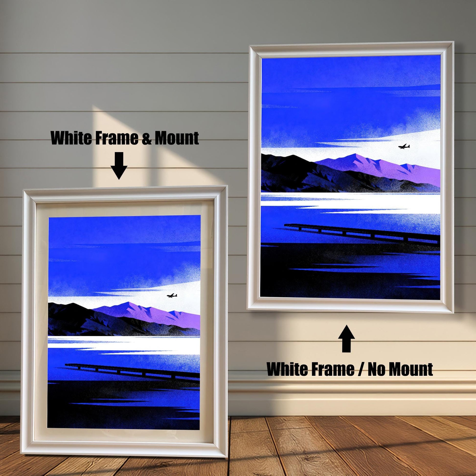 Blue Lake/Mountain	Comparison image showing the Blue Lake/Mountain art print in a White Frame & Mount (left) and a White Frame / No Mount (right), against a white wood-paneled wall.