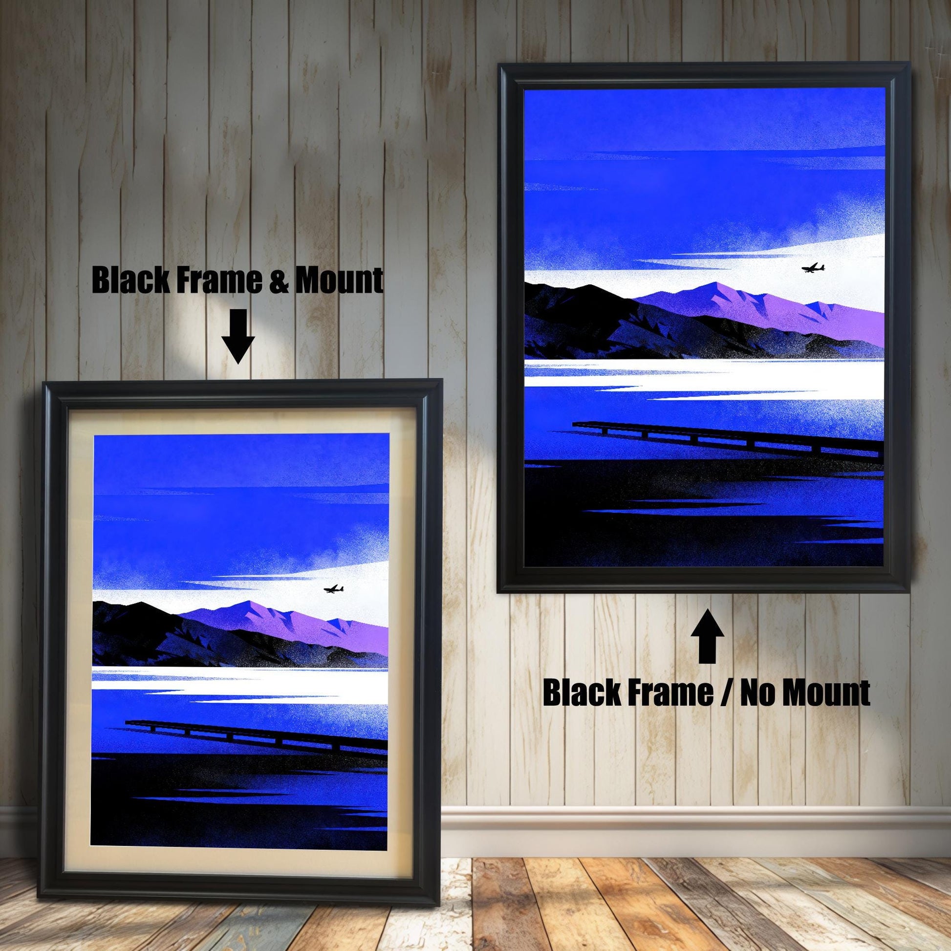 Comparison image showing the Blue Lake/Mountain art print in a Black Frame & Mount (left) and a Black Frame / No Mount (right), against a rustic wood-paneled wall.