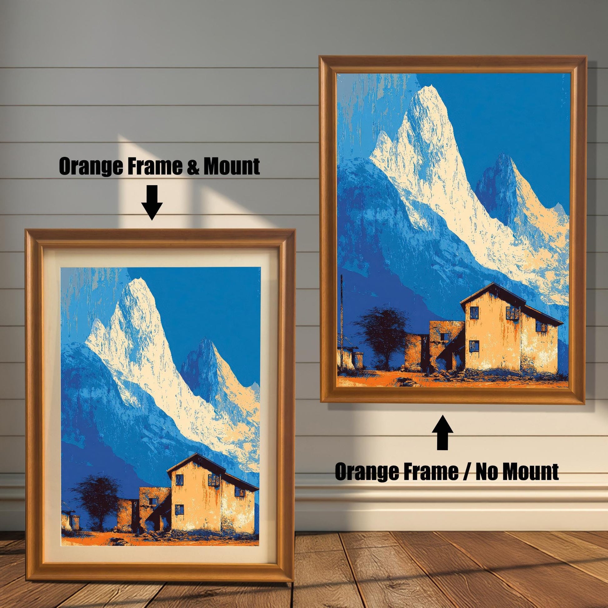 Landscape art print, side-by-side comparison of an orange/light brown wood frame with a mount (mat) and an orange wood frame with no mount, against a white panel wall.