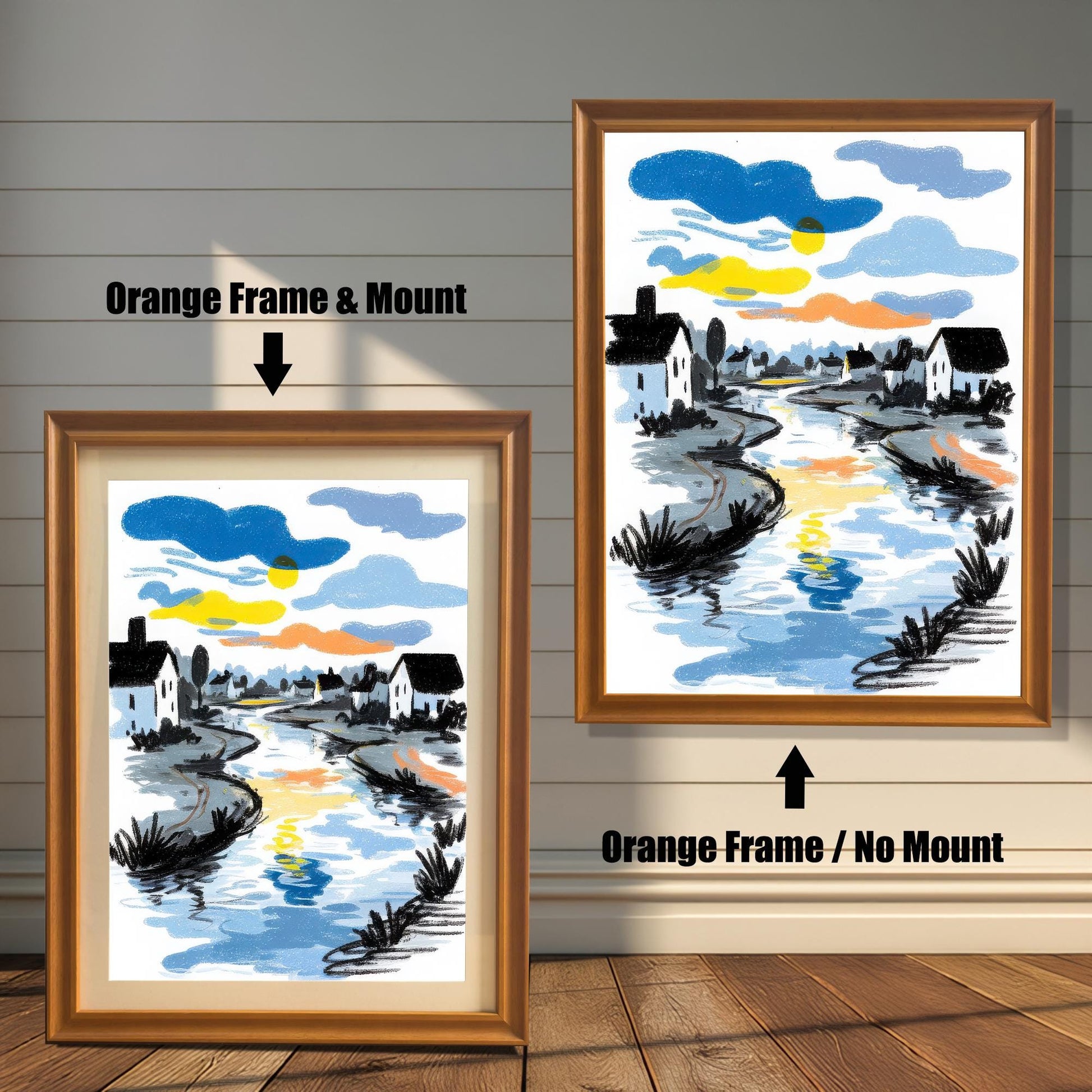 A comparison image showing the river art print in an Orange Frame & Mount (with a light mat) on the left, and an Orange Frame / No Mount (full bleed print) on the right, against a white wainscoted wall.