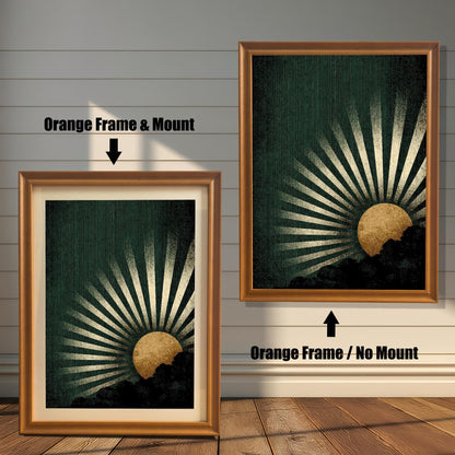 A side-by-side comparison of the dark green and gold sunburst art print framed in an Orange Frame. The image on the left shows the print with a mount (matting), and the image on the right shows it without a mount.