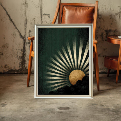 The dark green and gold sunburst art print in a White Frame without a mount, standing on a concrete floor. It is positioned in front of a leather and wooden accent chair against a distressed concrete wall.