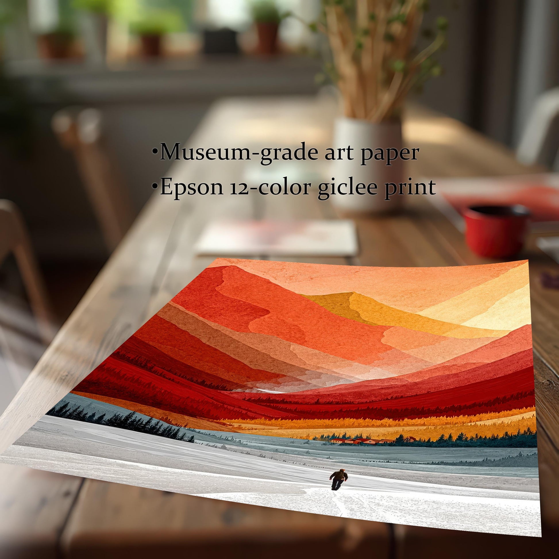 Close-up of the mountain landscape printed on museum-grade art paper using a professional 12-color giclee printing process on a wooden table.