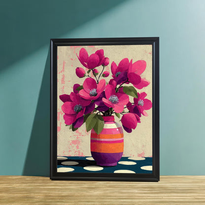 A black-framed art print of a pink floral bouquet in a striped vase, resting on a textured wooden surface against a teal-colored wall.