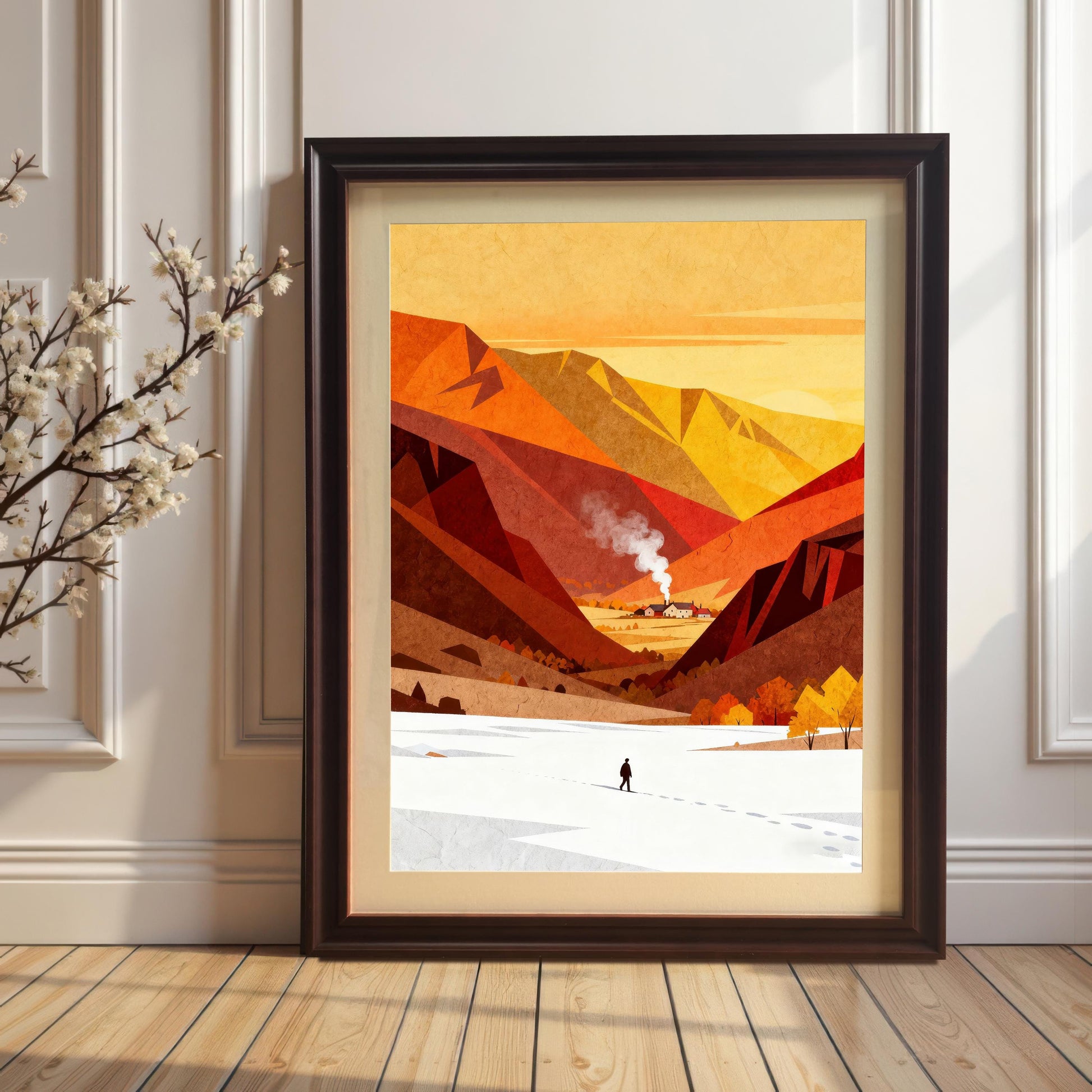 Large framed landscape print with a cream mat mount in a dark Coffee-colored wood frame, leaning against a white paneled wall on a light wood floor.