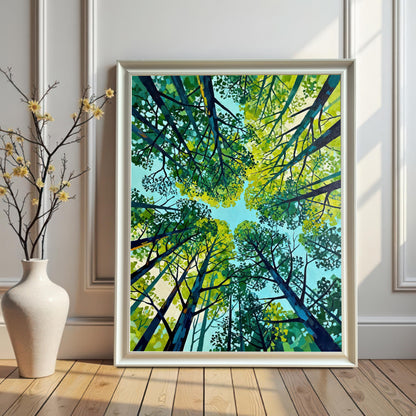 Vertical green tree art print in a sleek white wood frame, leaning against a paneled white wall next to a white ceramic vase with delicate yellow flowers.
