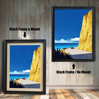 Comparison of two black framed prints: one with a cream-colored mat board (mount) and one without a mount, showing the coastal artwork in a black wooden frame.