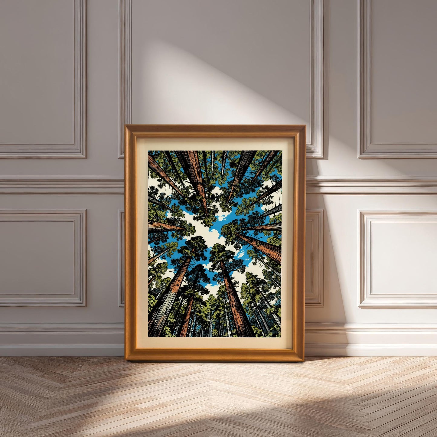 Large orange wood framed redwood tree art print with a white mount, resting on a herringbone wood floor in a bright, sunlit room.