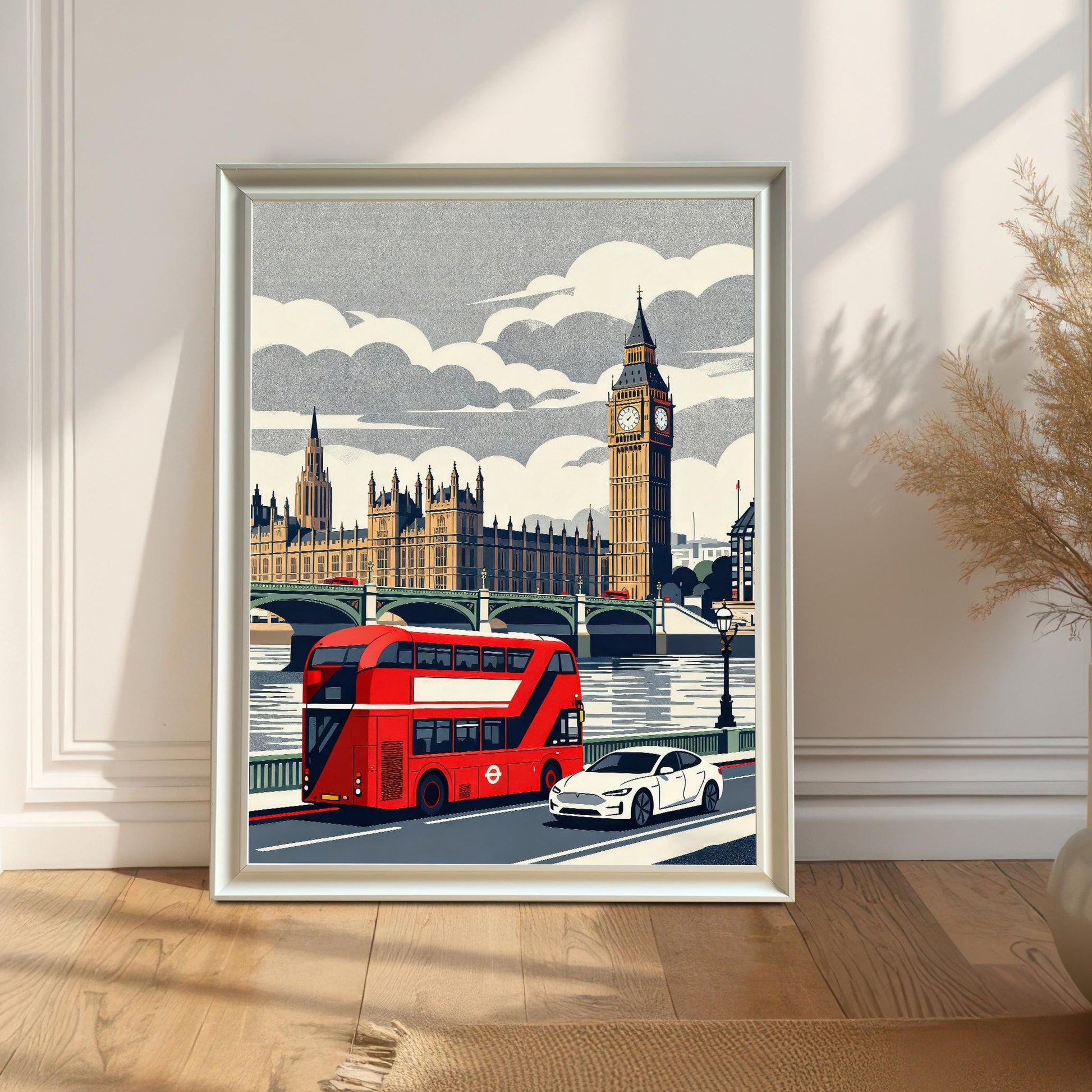 A white wood-framed London illustration leaning against a bright, minimalist wall on a light wood floor, catching natural sunlight and shadows.