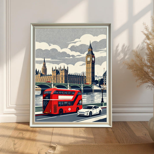A white wood-framed London illustration leaning against a bright, minimalist wall on a light wood floor, catching natural sunlight and shadows.