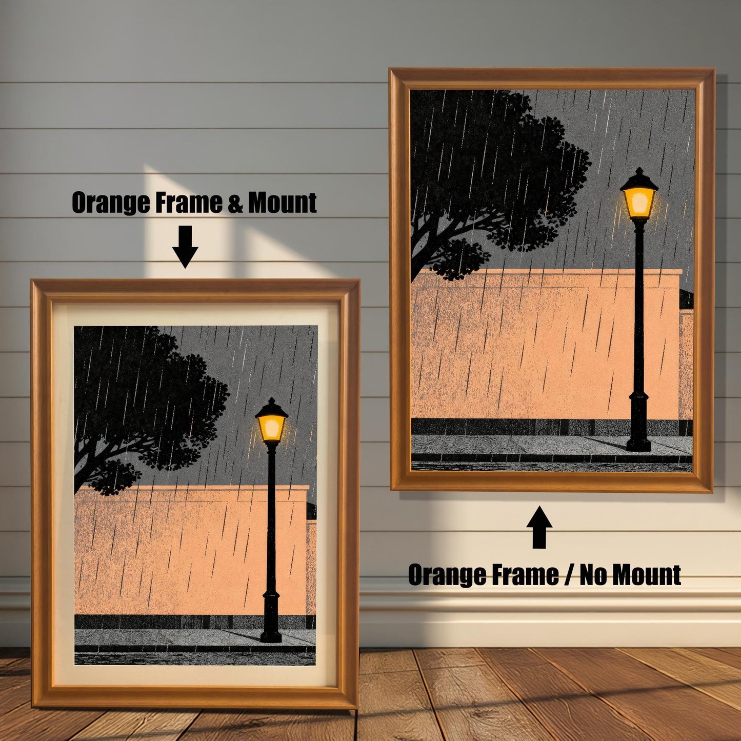 Comparison of the orange wood frame option showing two versions: one with a white mat board (mount) and one without, featuring an illustration of a street lamp in the rain against a peach wall.