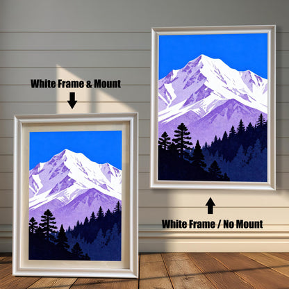 Comparison image of the mountain art print: A smaller print in a 'White' wood frame with a cream mount, next to a larger print in a 'White' wood frame without a mount.