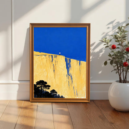The art print in an orange wood frame, resting on a light wood floor against a white paneled wall, next to a white planter with a small, green plant with red berries.