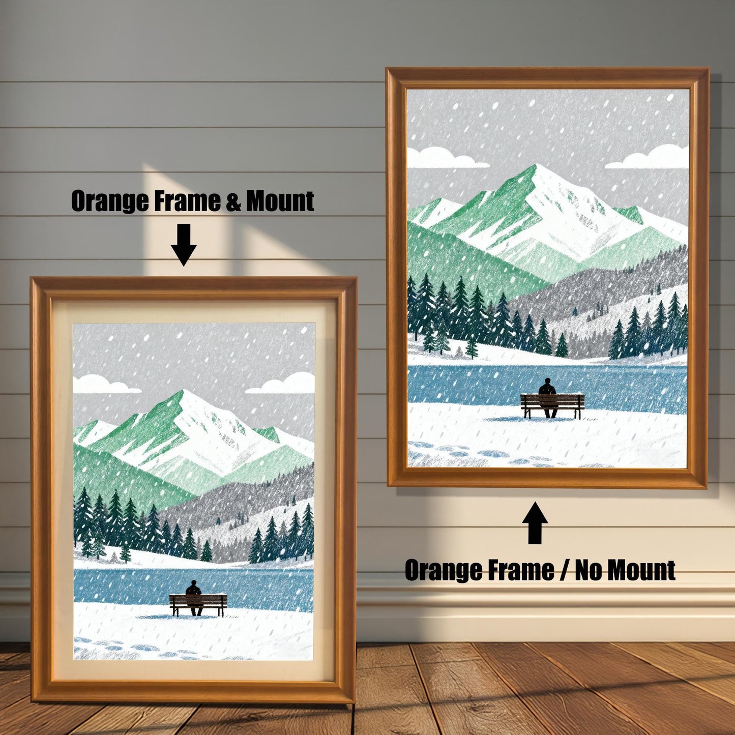 A wood framed art print of a snowy mountain and lake scene. The image shows two framing options: Orange Frame with a Mount (left, smaller) and Orange Frame without a Mount (right, larger). A person sits on a bench by the lake.