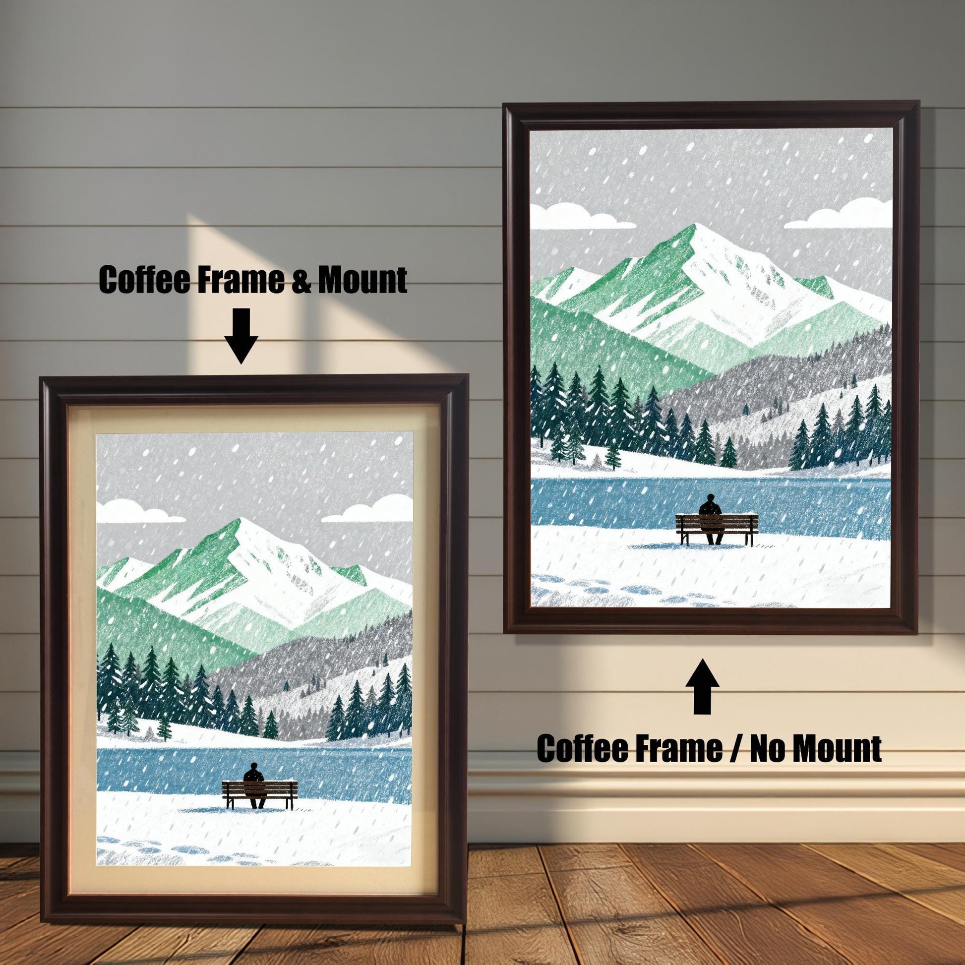 A wood framed art print of a snowy mountain and lake scene. The image shows two framing options: Coffee Frame with a Mount (left, smaller) and Coffee Frame without a Mount (right, larger). A person sits on a bench by the lake.