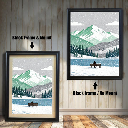 A wood framed art print of a snowy mountain and lake scene. The image shows two framing options: Black Frame with a Mount (left, smaller) and Black Frame without a Mount (right, larger). A person sits on a bench by the lake.