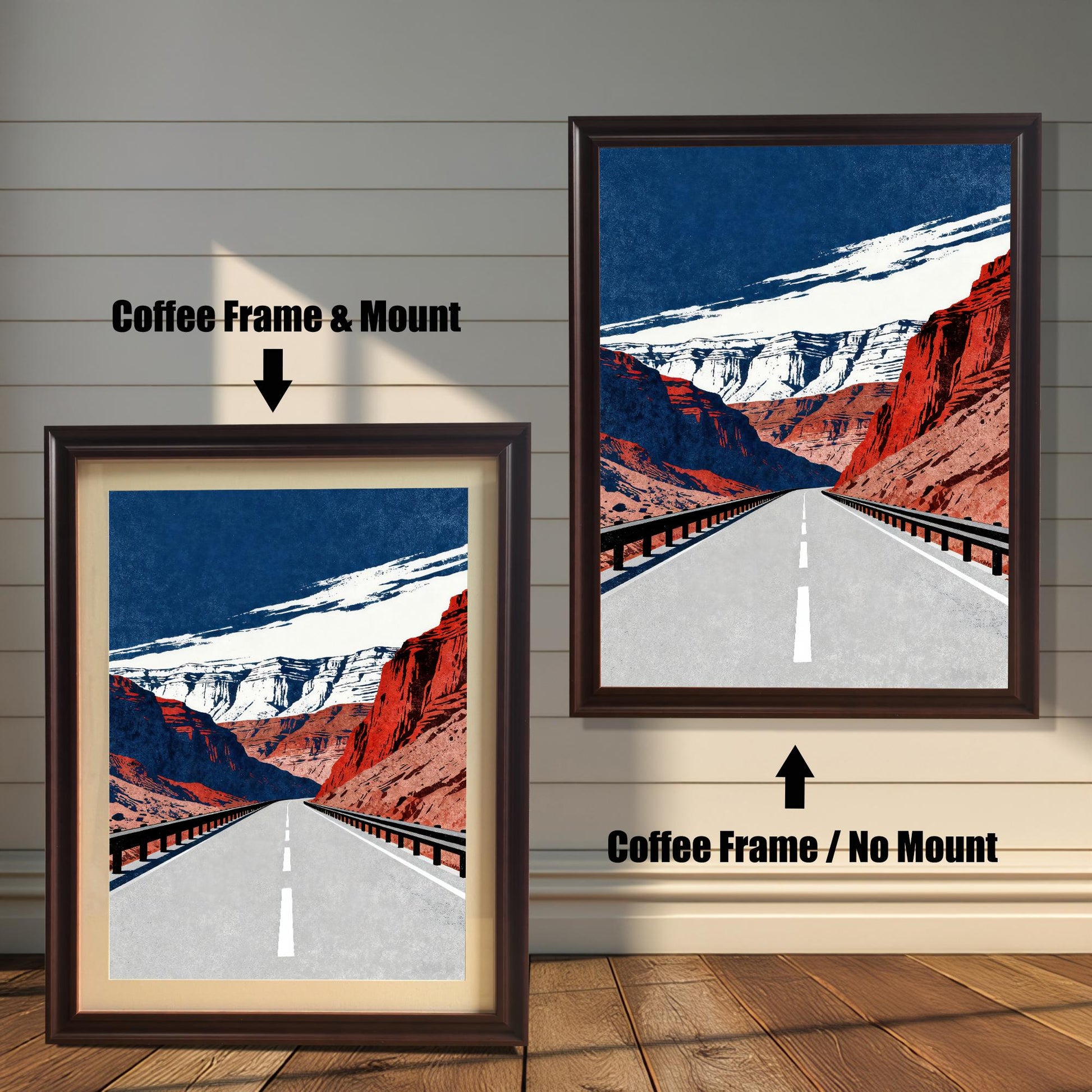 A side-by-side comparison of a framed art print. The image on the left has a Coffee Frame & Mount (a white border or matting) and the image on the right has a Coffee Frame / No Mount. The art depicts a long, straight road through red rock canyons under a dark blue and white sky.