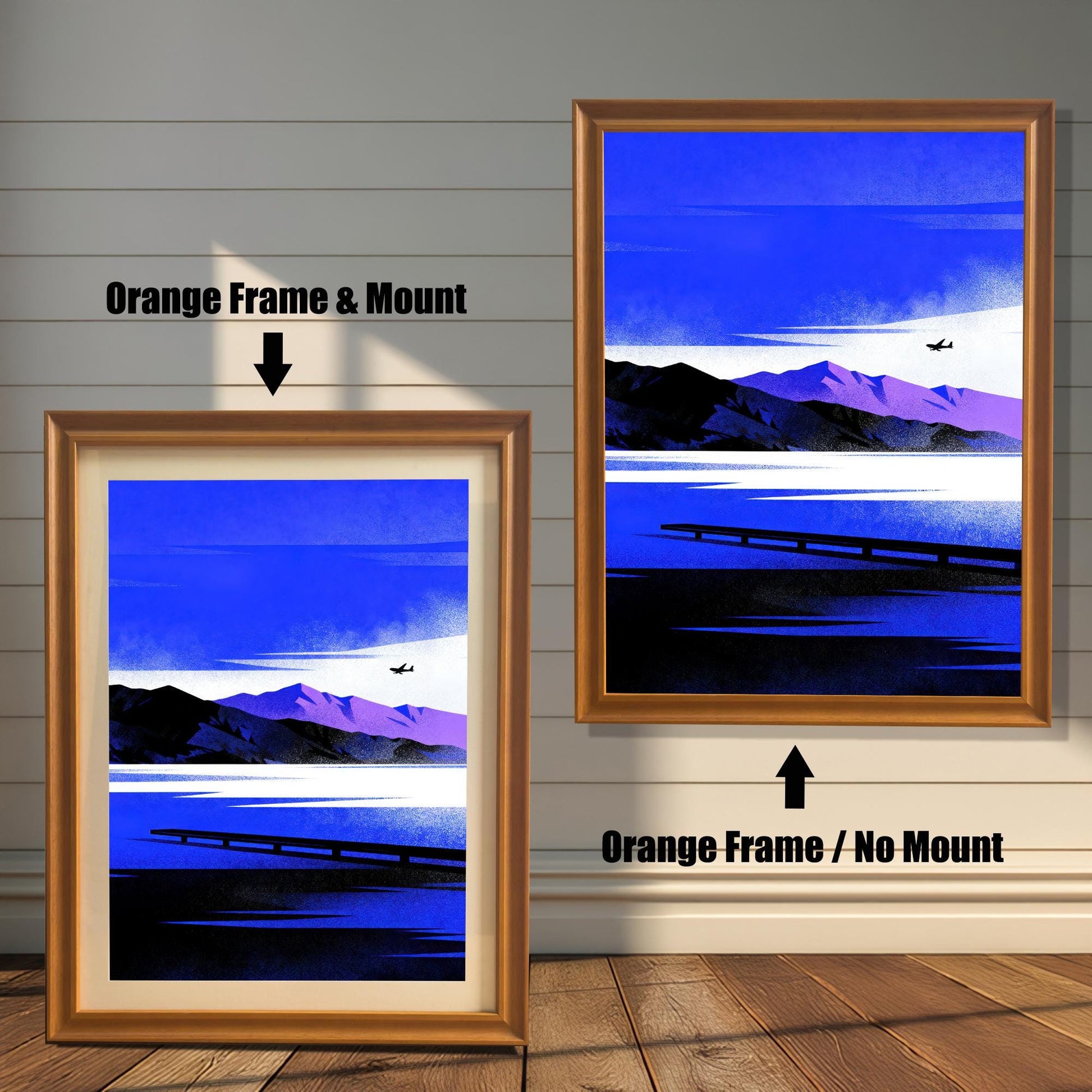 Blue Lake/Mountain	Comparison image showing the Blue Lake/Mountain art print in an Orange Frame & Mount (left) and an Orange Frame / No Mount (right), against a rustic wood-paneled wall.
