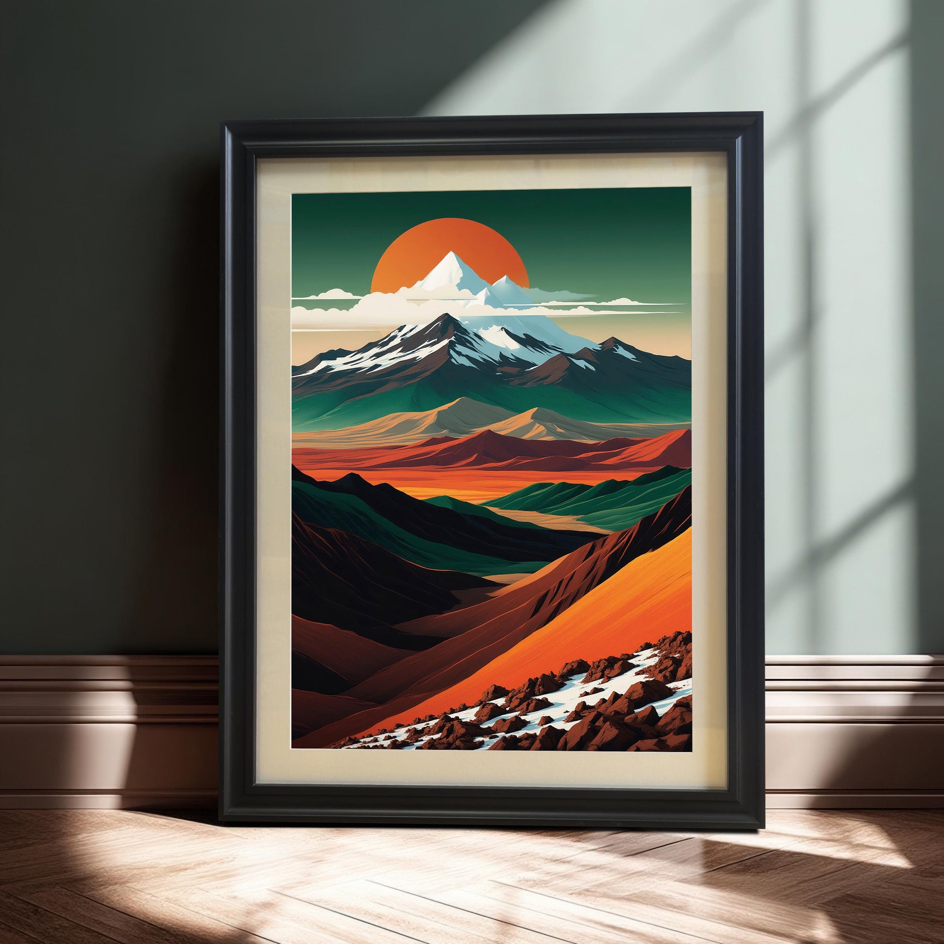 The mountain landscape art in a sleek black wood frame, leaning against a dark teal wall. Dramatic sunlight highlights the texture of the wood floor and the frame.