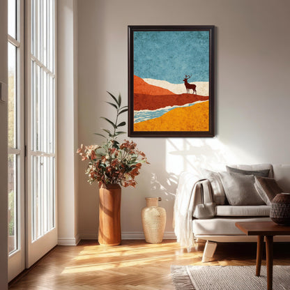 A vertical dark-wood coffee frame featuring the colorful stag landscape hung in a bright, modern living room above a white sofa with neutral pillows and a large floor vase.