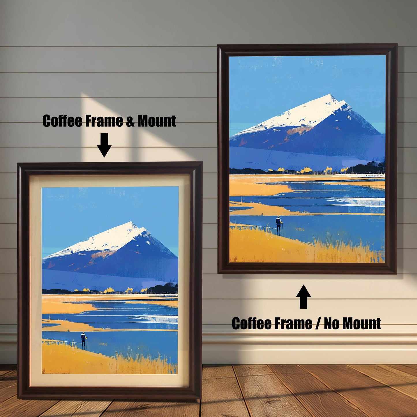 A comparison of two framing options for the mountain landscape art. On the left, the piece is shown with a "Coffee Frame & Mount," featuring a dark brown wood frame and an off-white border. On the right, the "Coffee Frame / No Mount" option shows the art filling the entire dark brown frame.