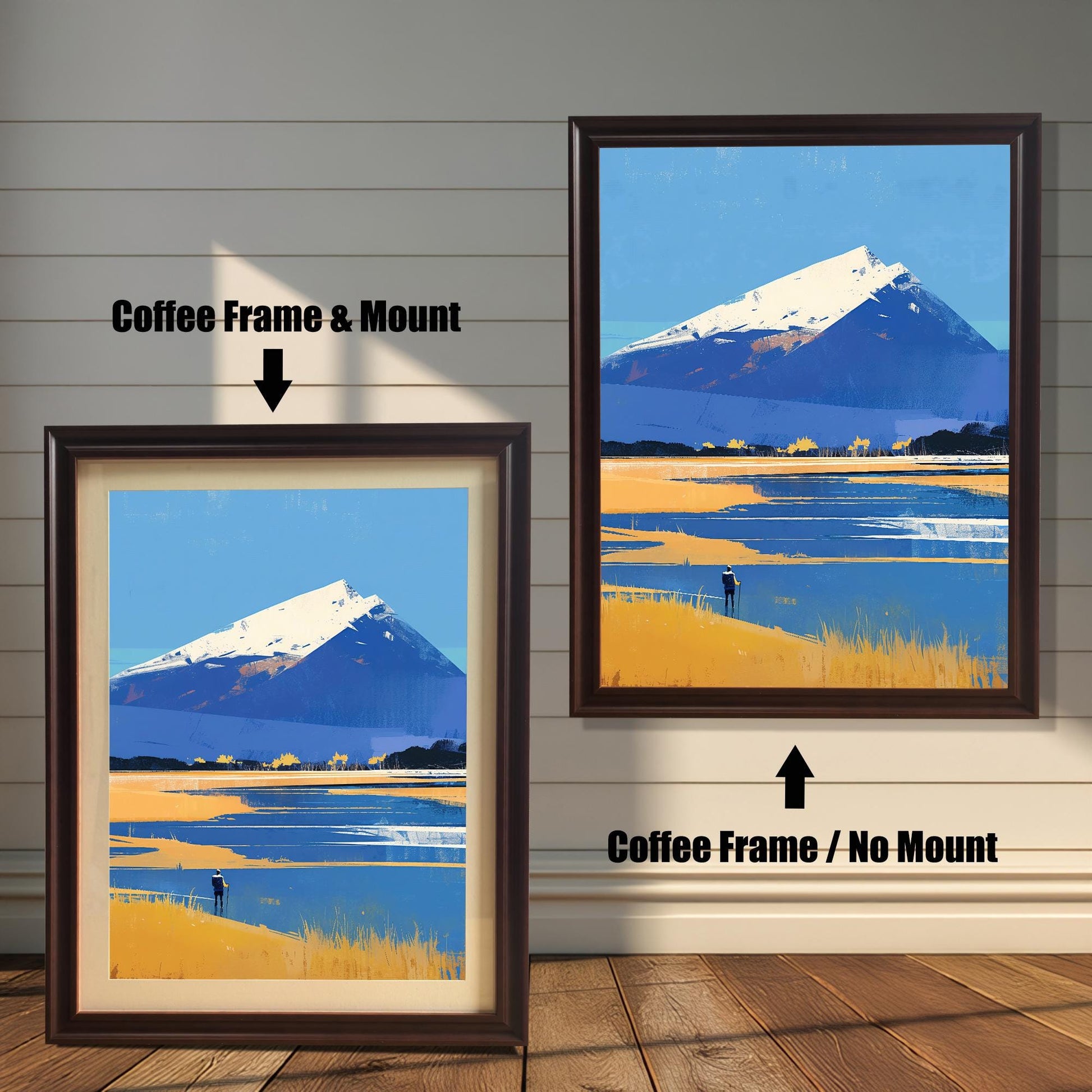 A comparison of two framing options for the mountain landscape art. On the left, the piece is shown with a "Coffee Frame & Mount," featuring a dark brown wood frame and an off-white border. On the right, the "Coffee Frame / No Mount" option shows the art filling the entire dark brown frame.