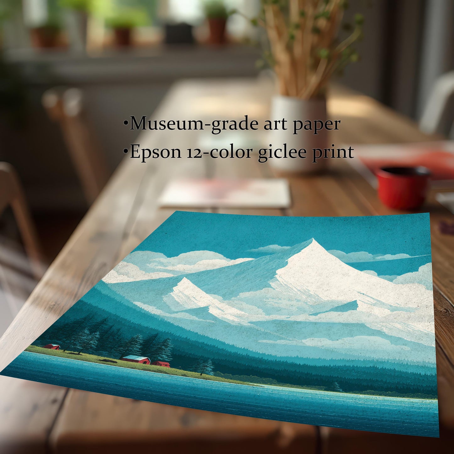 Close-up of a high-quality giclee print on museum-grade art paper, displaying vibrant teal and white mountain scenery on a wooden table.
