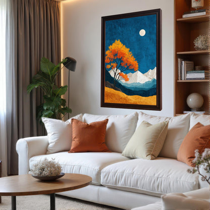A large, coffee-colored wood framed landscape print mounted on a white wall above a modern white sofa with orange and cream cushions in a bright, professionally styled living room.
