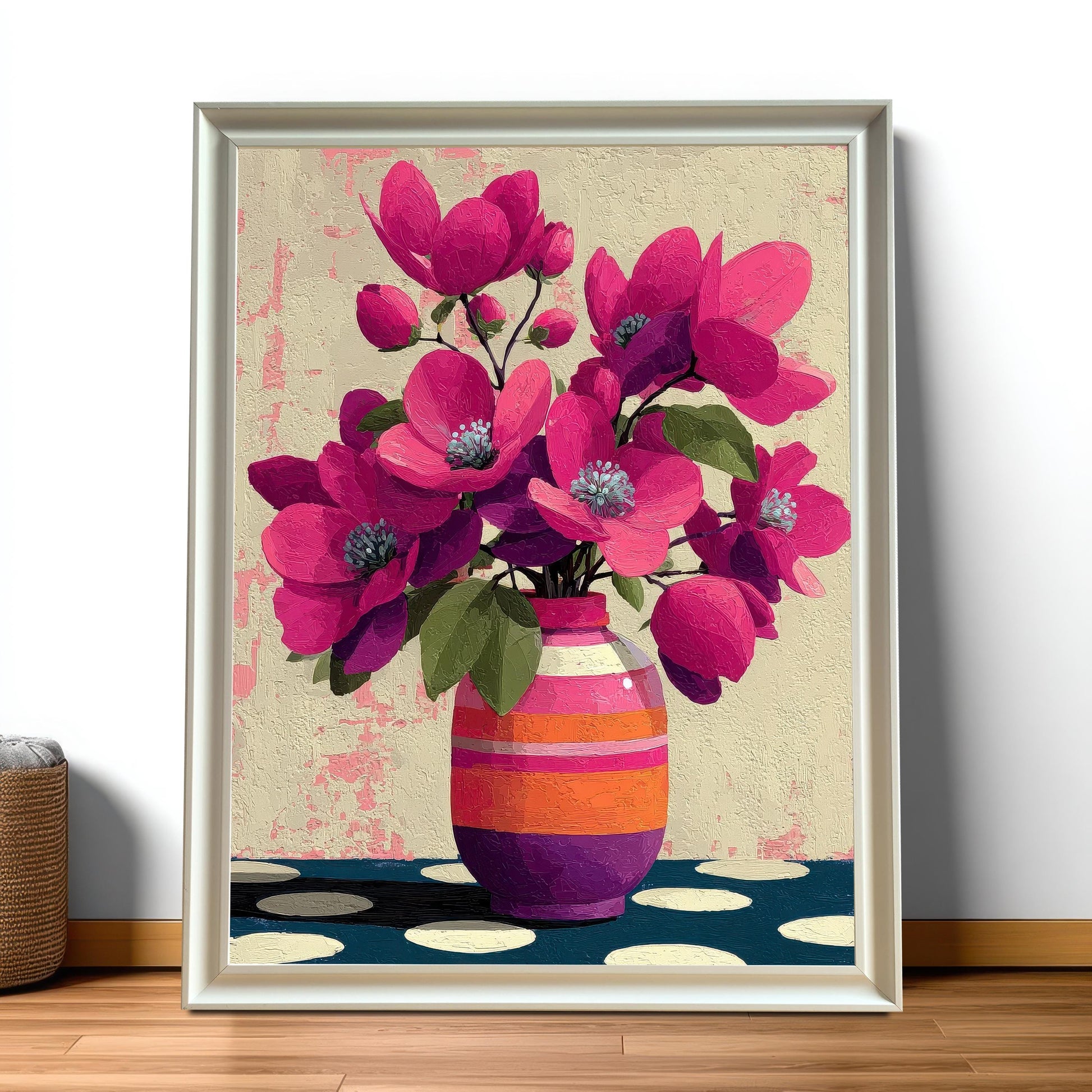 Large white-framed floral wall art featuring vibrant pink flowers, leaning against a clean white wall on a polished wooden floor.