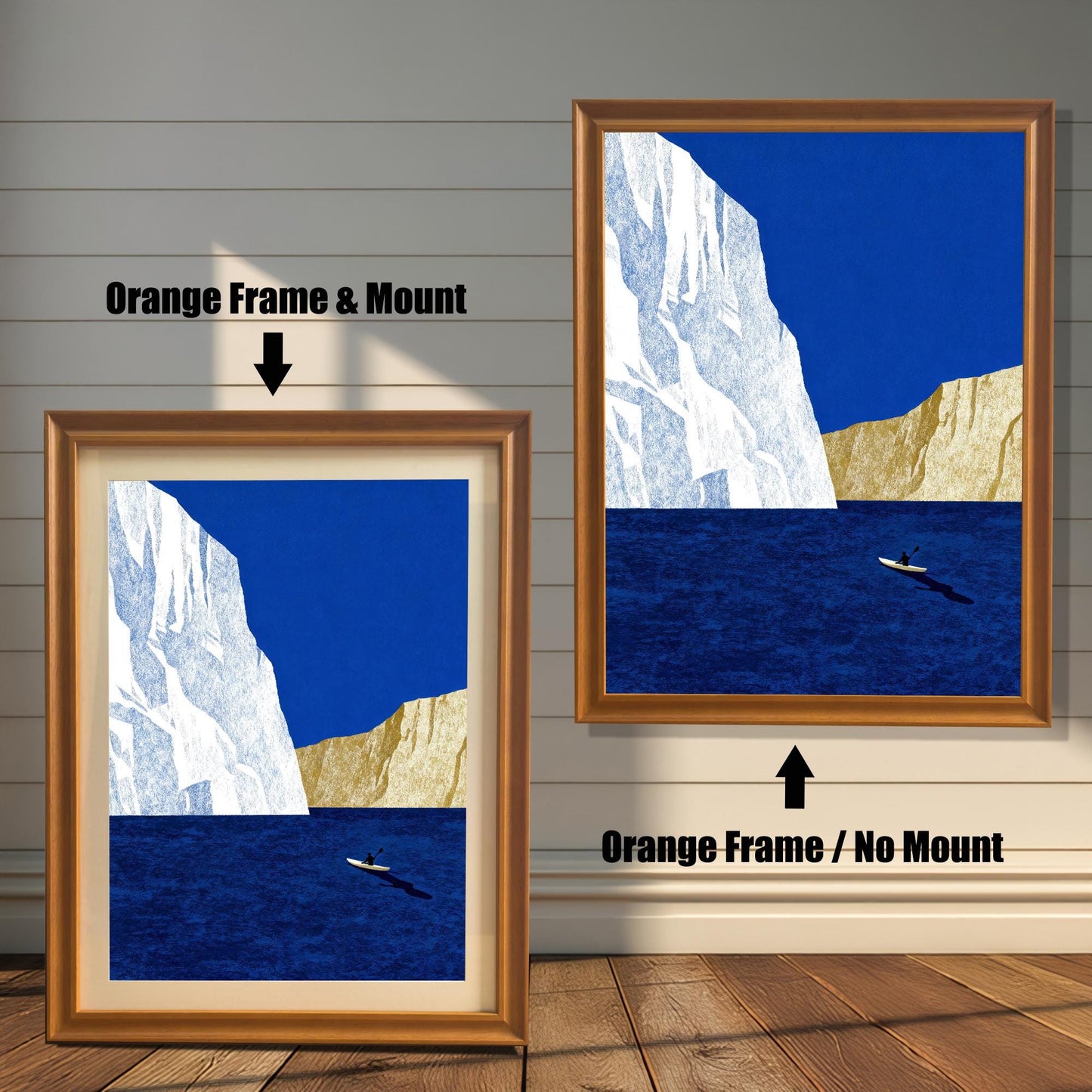 Comparison of two orange wood frames: one featuring a cream-colored mat board (mount) and one without a mount, showcasing a blue and gold nautical art print.