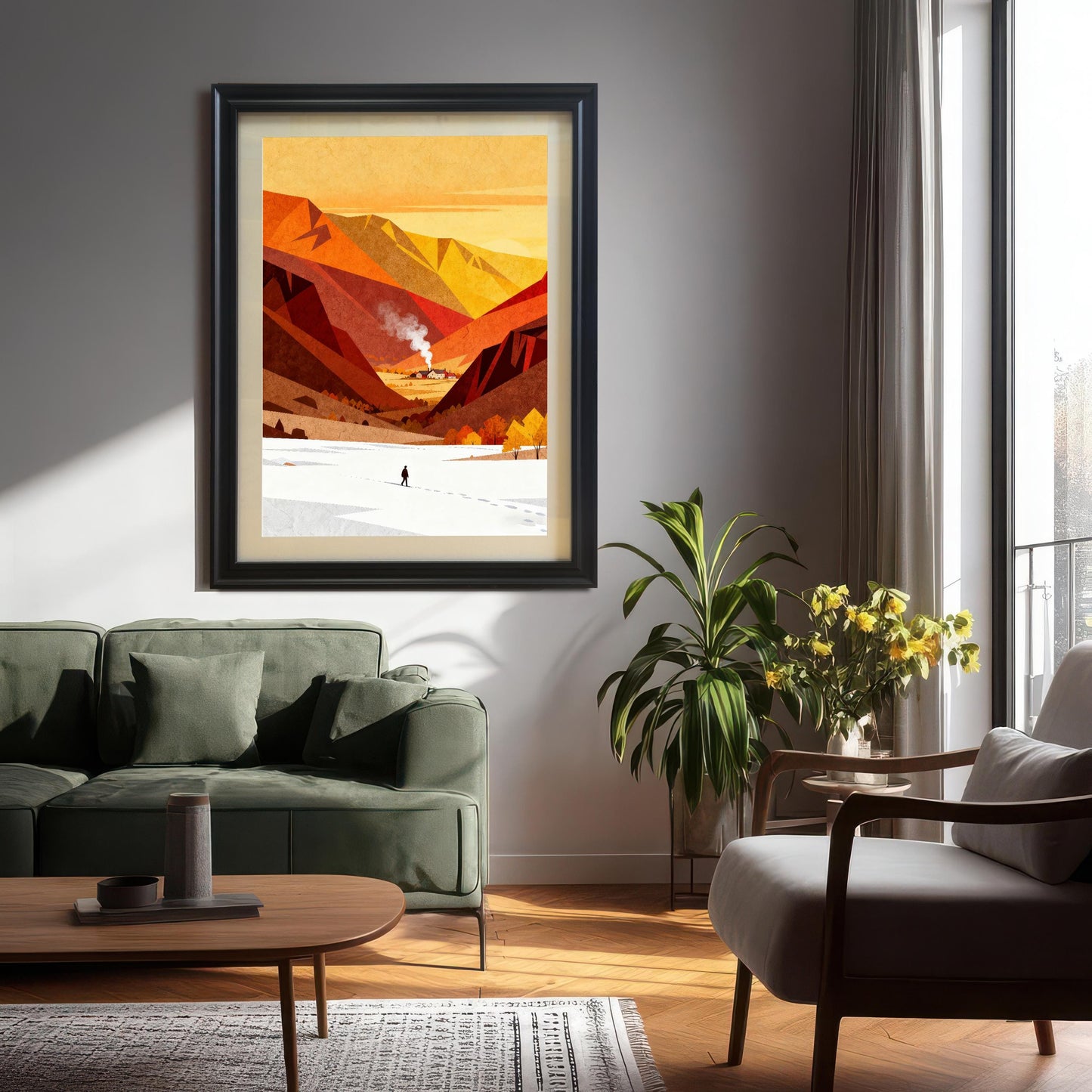 Minimalist landscape art print in a large black frame with a white mount, hanging on a white wall above a modern green sofa in a sunlit living room.