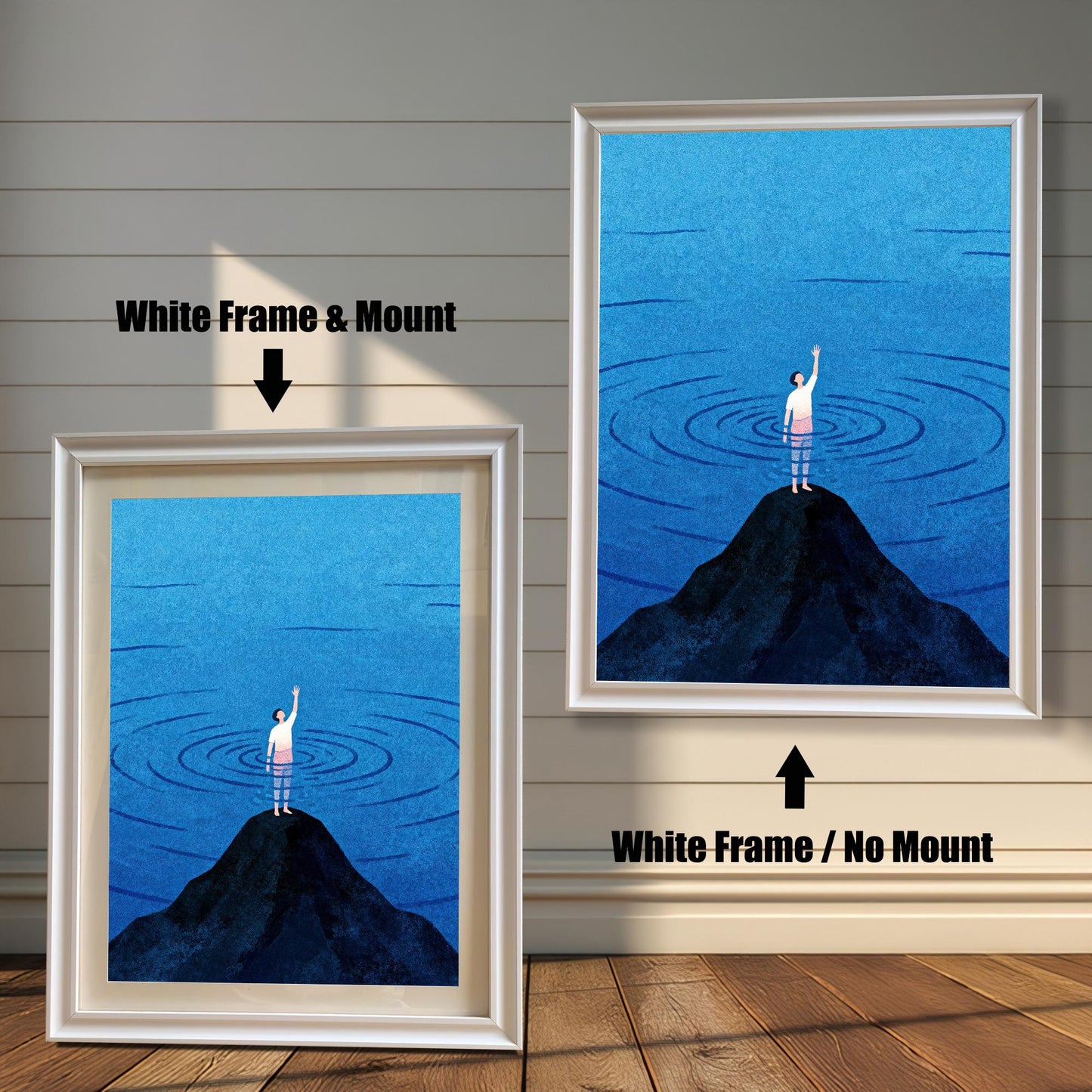 Comparison of two white wood frames. The left option includes a white mat (mount) surrounding the blue minimalist illustration, and the right option shows the print framed without a mount.