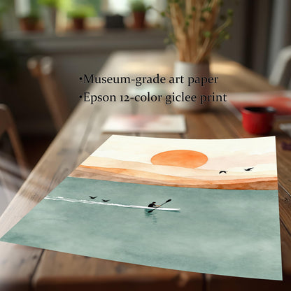 Close-up of a high-quality giclee print on museum-grade art paper showing a serene rowing scene and vibrant orange sun.