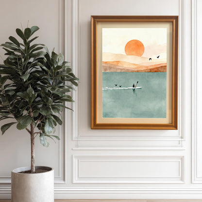 Framed watercolor landscape with a mat board hanging on a classic white paneled wall next to a large indoor fiddle leaf fig tree.