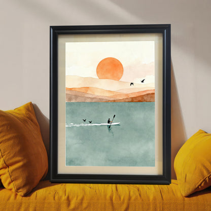Minimalist sunset rowing watercolor in a black wood frame with a mount, styled on a yellow sofa with matching mustard pillows.