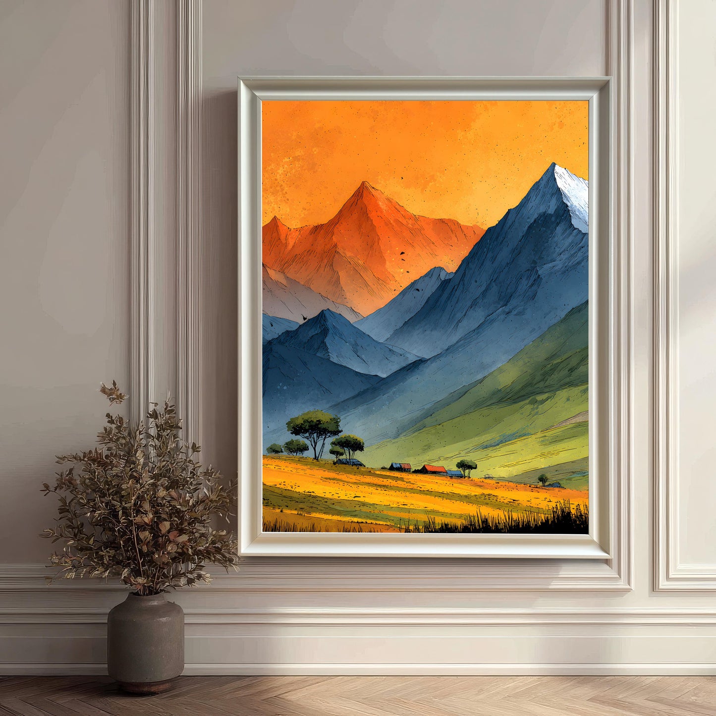 A white-framed art print of the mountain scene without a mount, hung on a white wainscoted wall. A decorative vase with dried branches sits on the floor beside it, creating a minimalist aesthetic.