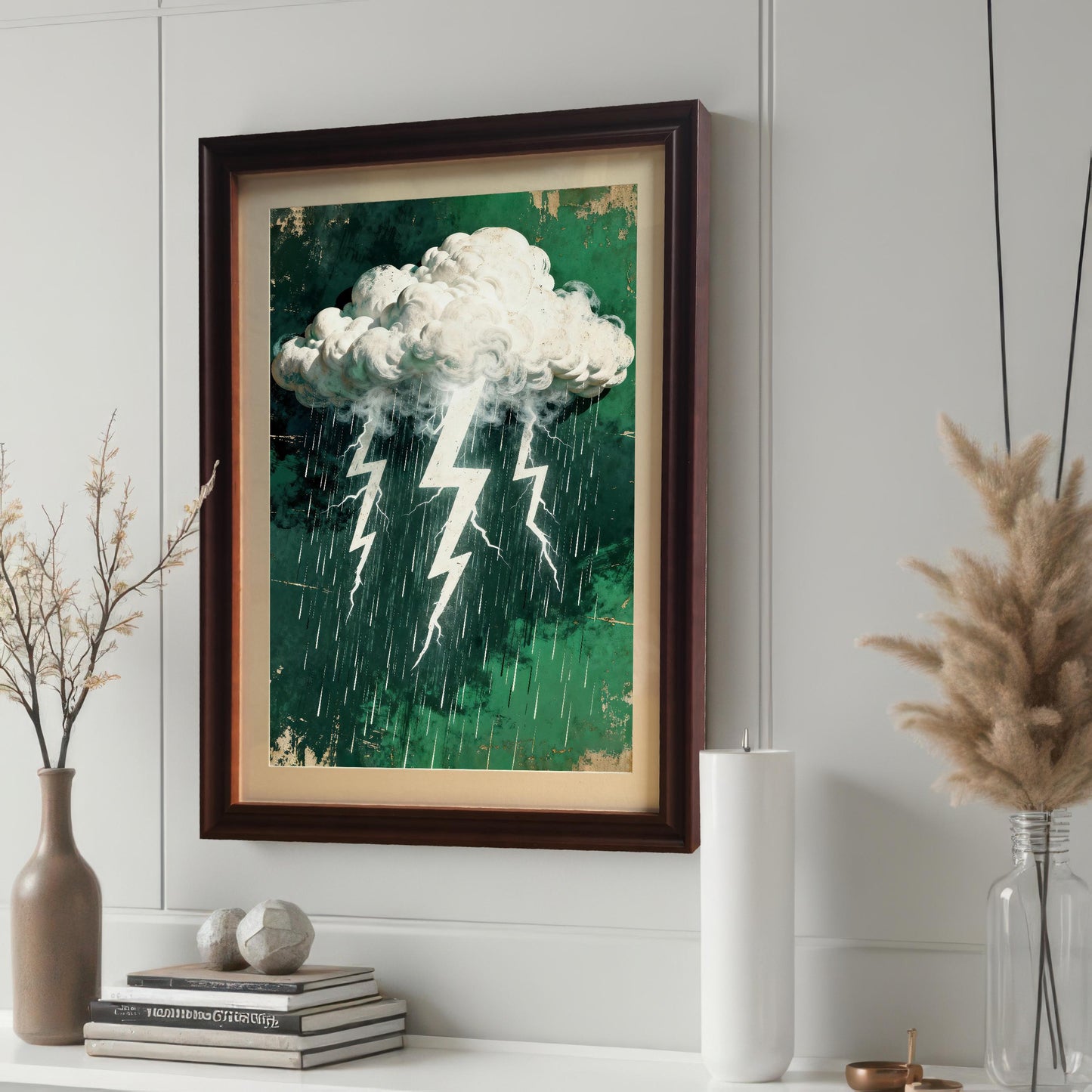 An art print featuring a stormy cloud, lightning, and rain on a distressed green background, framed in a dark brown 'Coffee' wood frame with a cream mount, hanging on a paneled white wall.