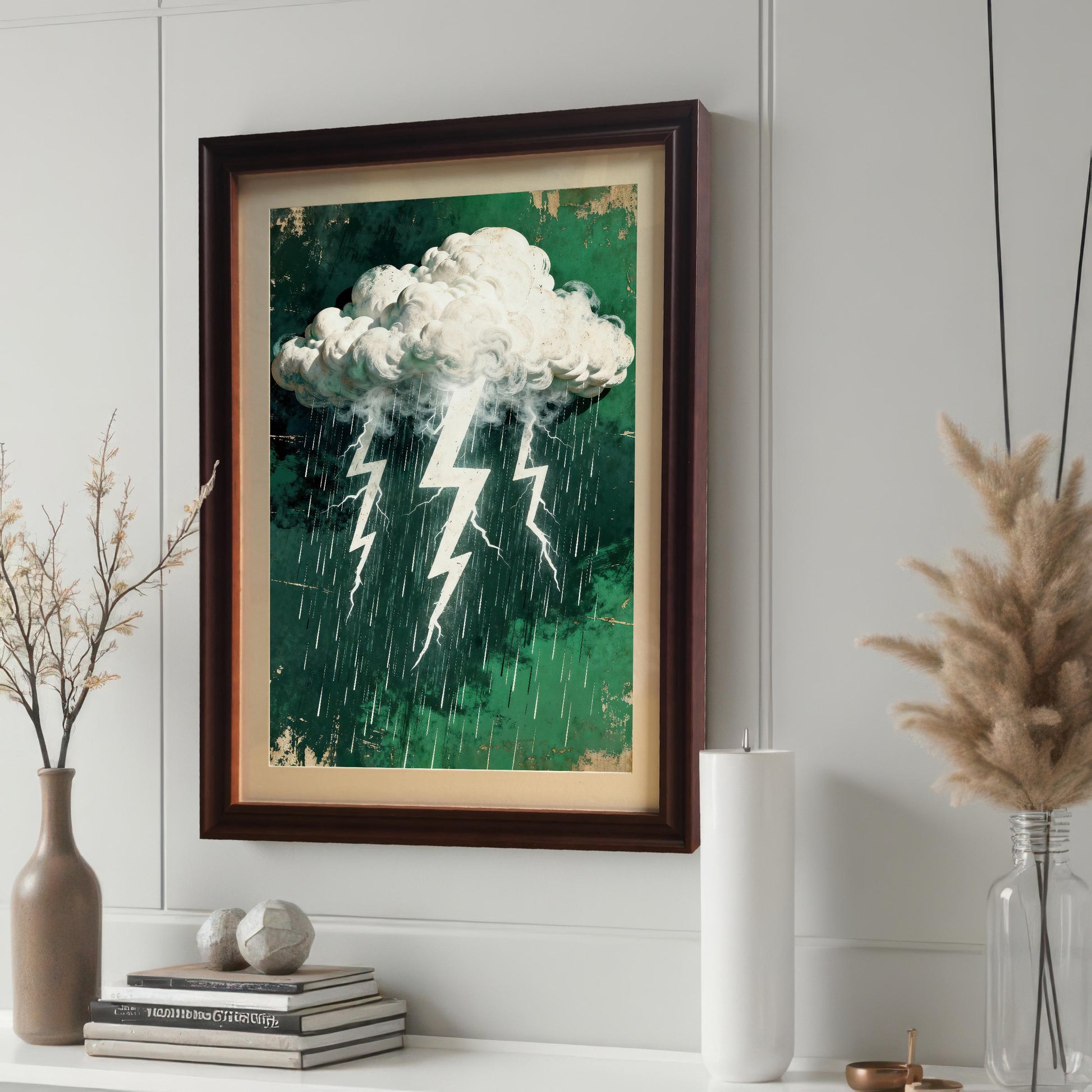 An art print featuring a stormy cloud, lightning, and rain on a distressed green background, framed in a dark brown 'Coffee' wood frame with a cream mount, hanging on a paneled white wall.