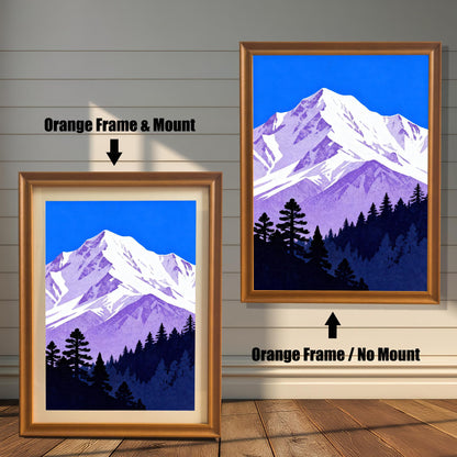 Comparison image of the mountain art print: A smaller print in an 'Orange' wood frame with a cream mount, next to a larger print in an 'Orange' wood frame without a mount.