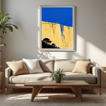The art print in a slim silver or white frame, hanging above a beige sofa with neutral throw pillows and a low, light wood coffee table in a sunlit living room.