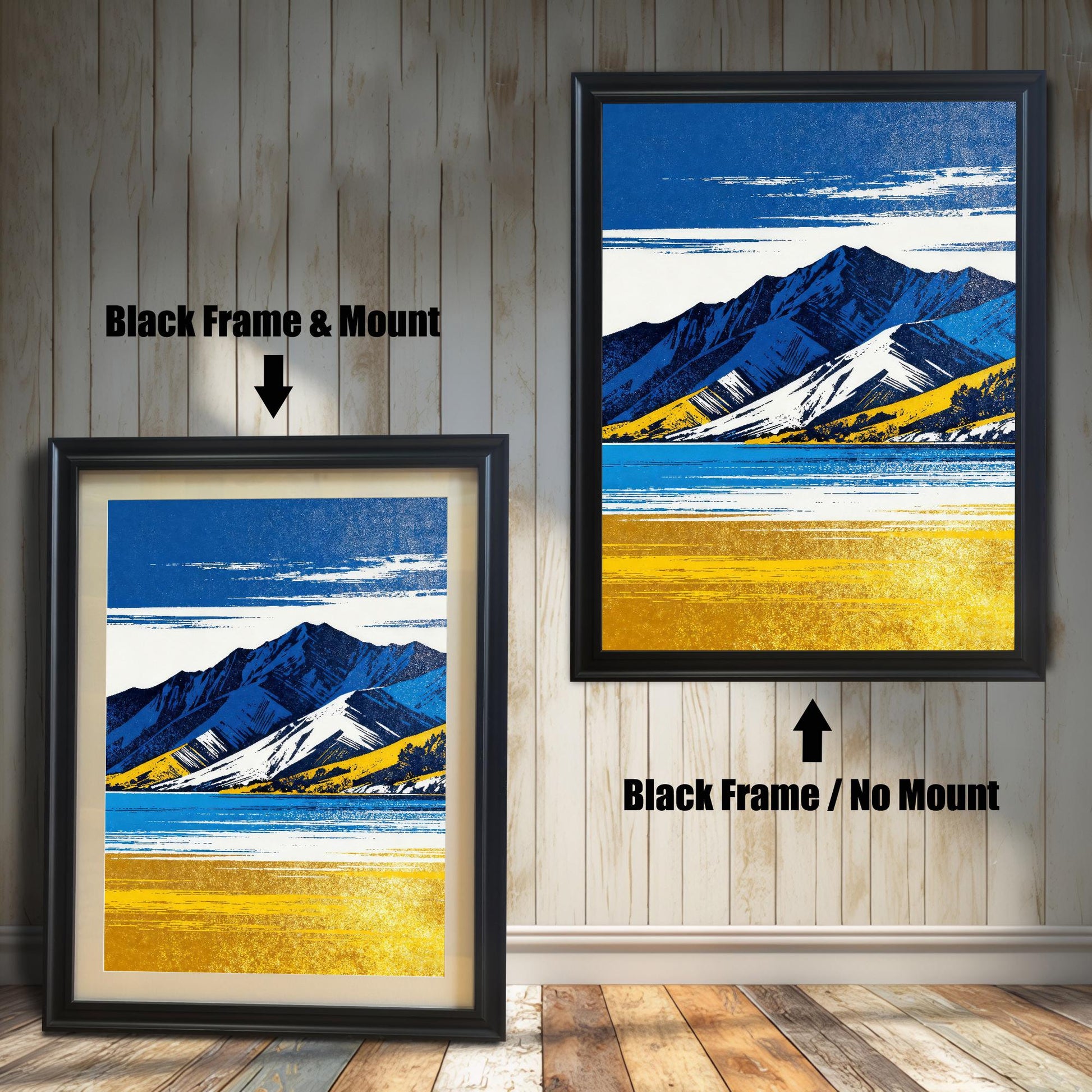 Two framed art prints on a wooden shiplap wall. Both prints feature the same blue and yellow mountain landscape. The left print shows the art in a Black Frame & Mount (matting). The right print shows the art in a Black Frame / No Mount.