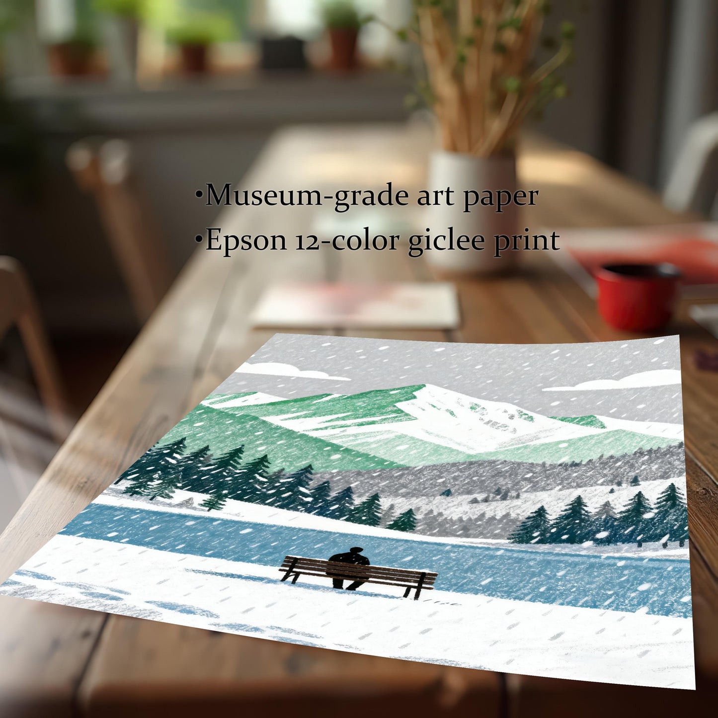 A loose print of the snowy mountain art design, displayed diagonally on a wooden table. Text mentions the print quality: Museum-grade art paper and Epson 12-color giclee print.