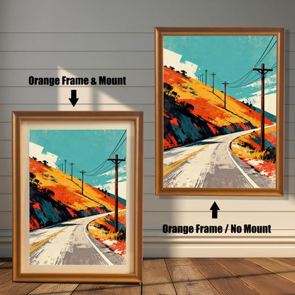 Comparison photo showing the art print in an Orange Frame with a mount (matting) on the left, and in an Orange Frame without a mount on the right. Both prints feature the winding road, orange hill, and teal sky art style. Text labels and arrows indicate the two options.