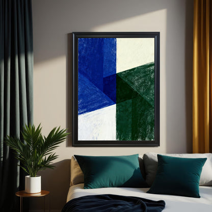 Abstract art print with geometric shapes in dark blue, deep green, and off-white. The print is showcased in a Black Frame and is hanging above a bed with teal and gray pillows, flanked by dark teal and mustard yellow curtains. A potted plant is visible on a side table.