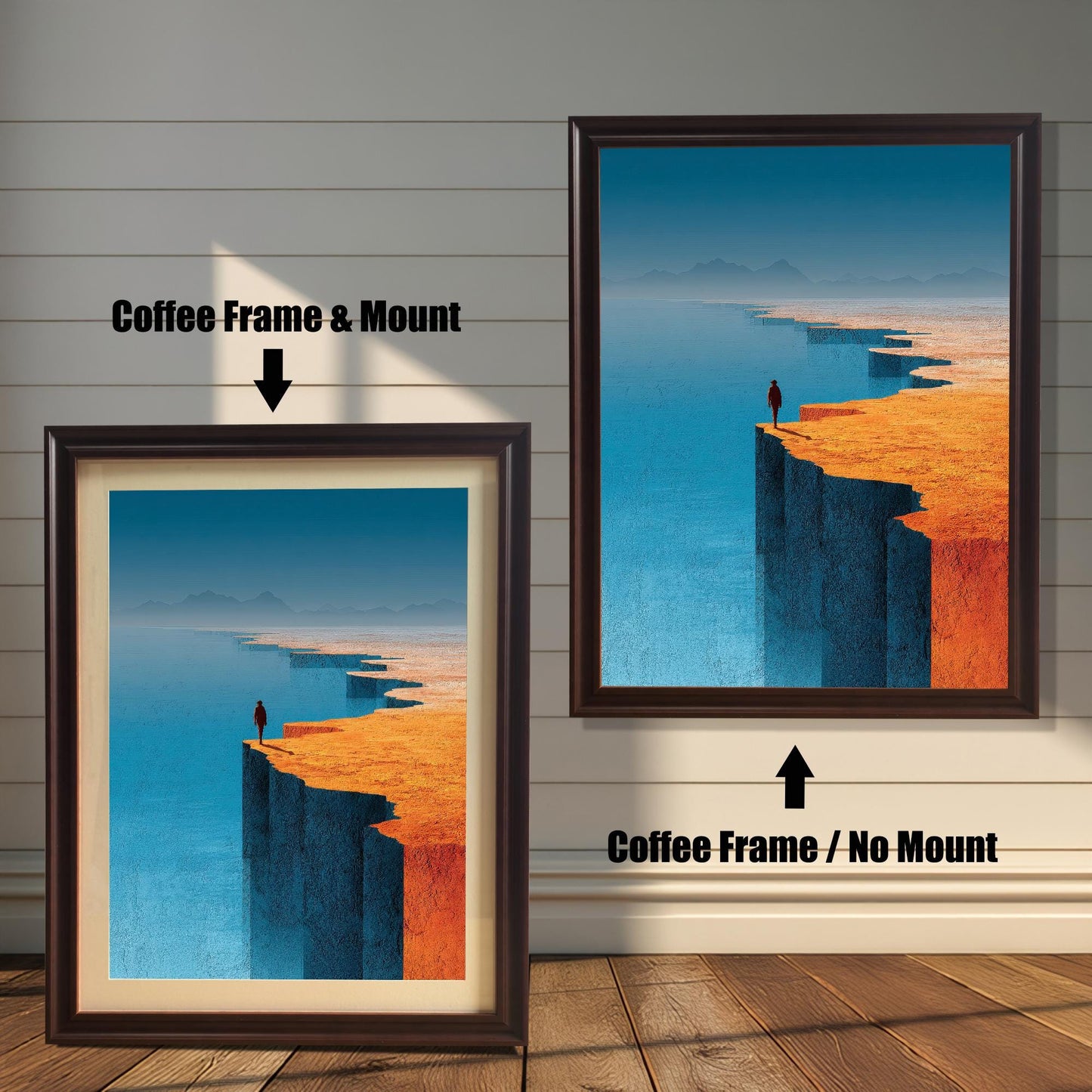 A product comparison display showing two versions of a coffee-colored wood framed landscape print. The left version is displayed with an off-white mat (mount), while the right version is a full-bleed print without a mount.
