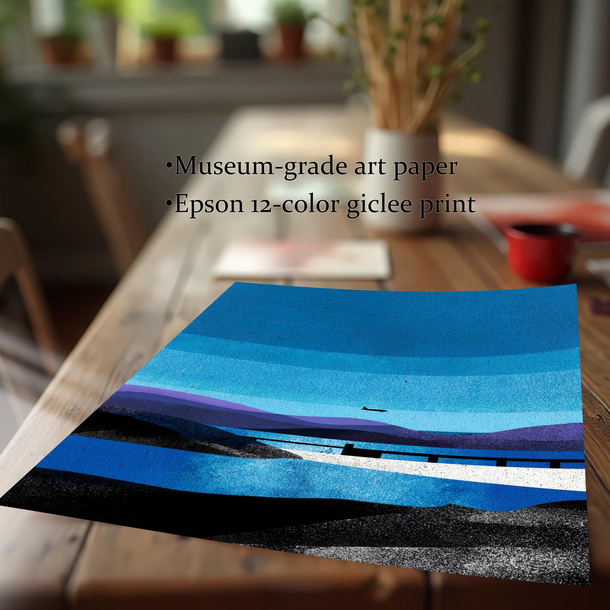 Close-up of the unframed landscape art print resting on a wooden table, featuring text highlighting "Museum-grade art paper" and "Epson 12-color giclee print" quality.