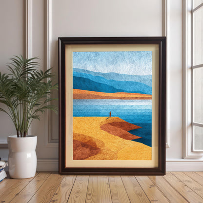 Minimalist landscape art print in a dark coffee wood frame with an off-white mat board, leaning against a white paneled wall next to a potted plant on hardwood floors.