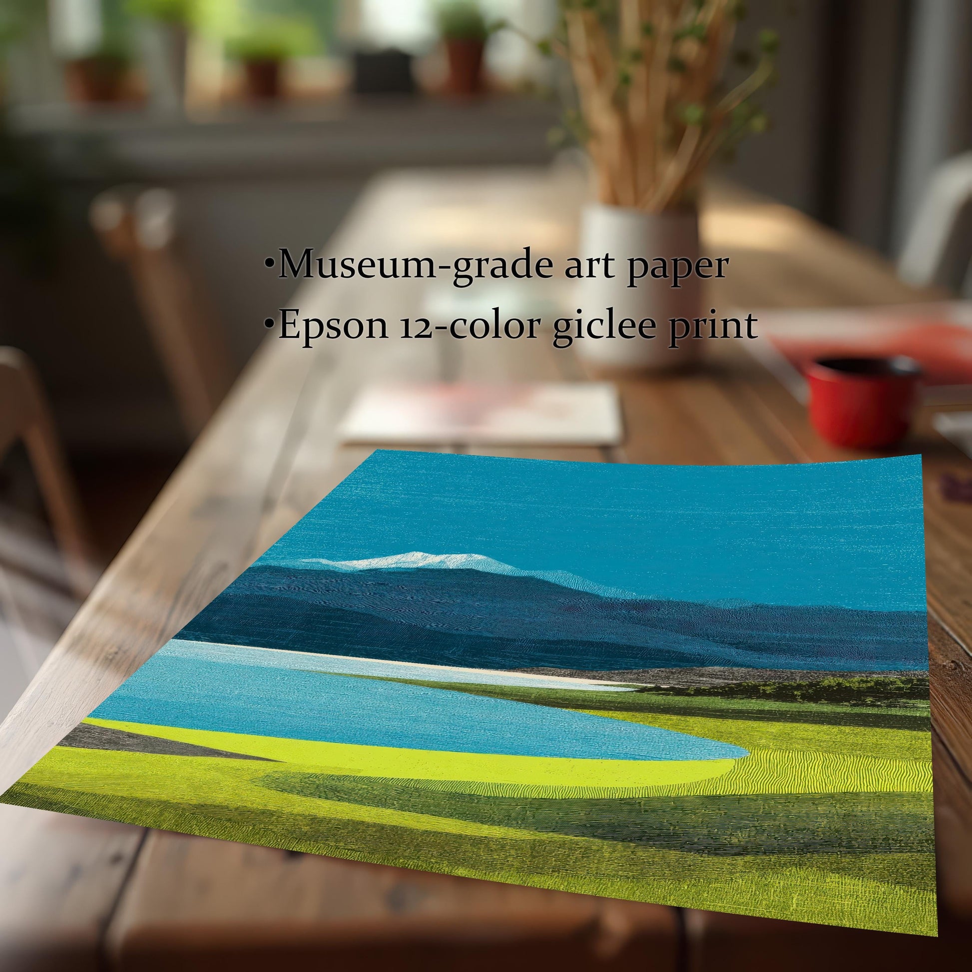 Close-up view of a textured landscape art print on a wooden table, highlighting ""Museum-grade art paper"" and ""Epson 12-color giclee print"" quality."