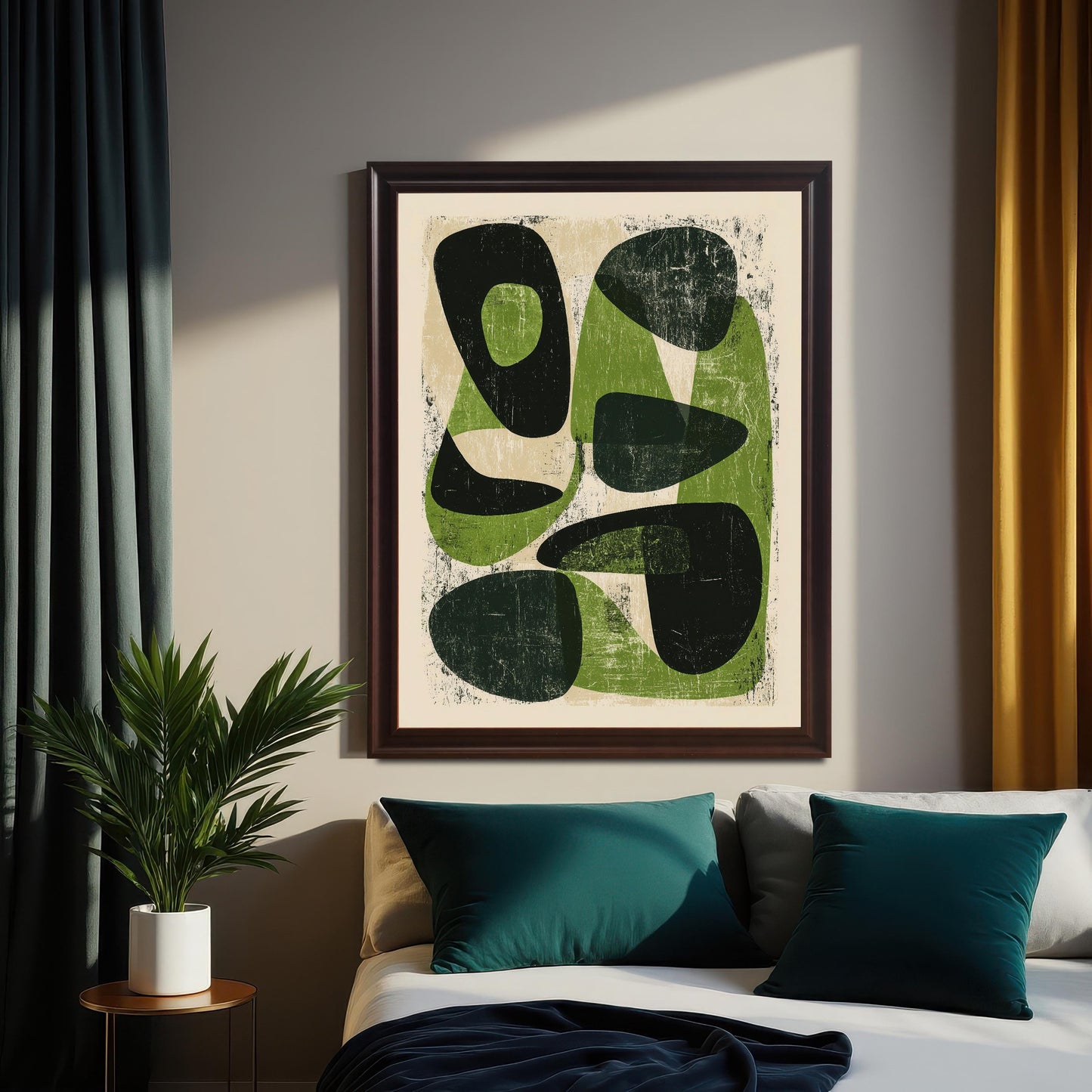 A large, dark wood-framed abstract print centered above a bed with deep teal pillows and a dark navy throw, flanked by a potted palm and contrasting yellow and dark grey curtains.