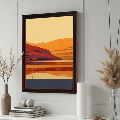 Detailed view of a coffee brown wood-framed art print displayed on a white shelf featuring decorative items like books, a tall white candle, and dried pampas grass.